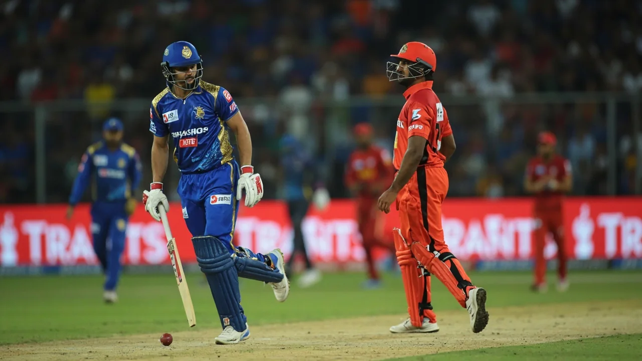 A captain and bowler in conversation during a break in play, the kind of tactical moment that decides a tight chase.